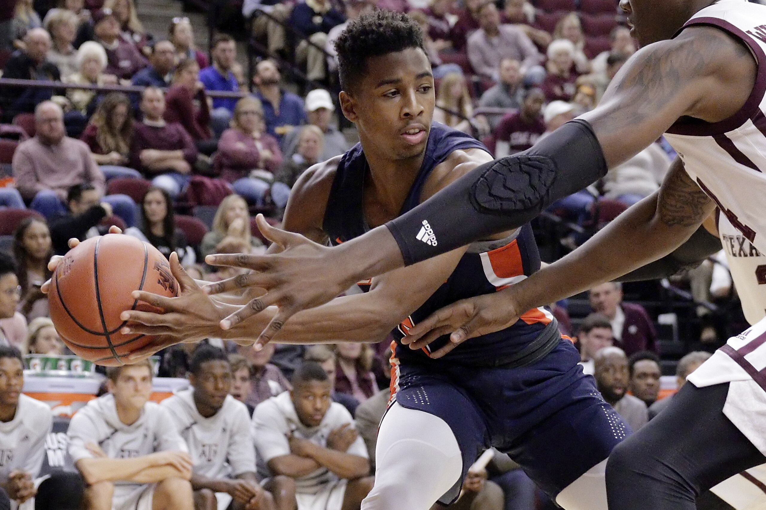 Pepperdine guard Jade' Smith (5) looks to pass around Texas A&M forward Robert Williams (44) during the second half of an NCAA college basketball game Friday, Nov. 24, 2017, in College Station, Texas. (AP Photo/Michael Wyke) Pepperdine guard Jade' Smith (5) looks to pass around Texas A&M forward Robert Williams (44) during the second half of an NCAA college basketball game Friday, Nov. 24, 2017, in College Station, Texas. (AP Photo/Michael Wyke)