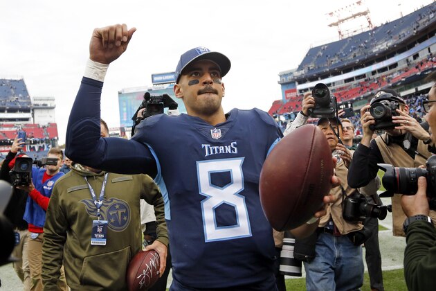 Tennessee Titans quarterback Marcus Mariota (8) leaves the field after the Titans beat the New England Patriots in an NFL football game Sunday, Nov. 11, 2018, in Nashville, Tenn. The Titans won 34-10. (AP Photo/James Kenney)