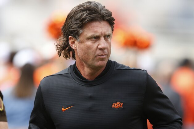 Oklahoma State head coach Mike Gundy runs onto the field before an NCAA college football game between Iowa Stateand Oklahoma State in Stillwater, Okla., Saturday, Oct. 6, 2018. (AP Photo/Sue Ogrocki)
