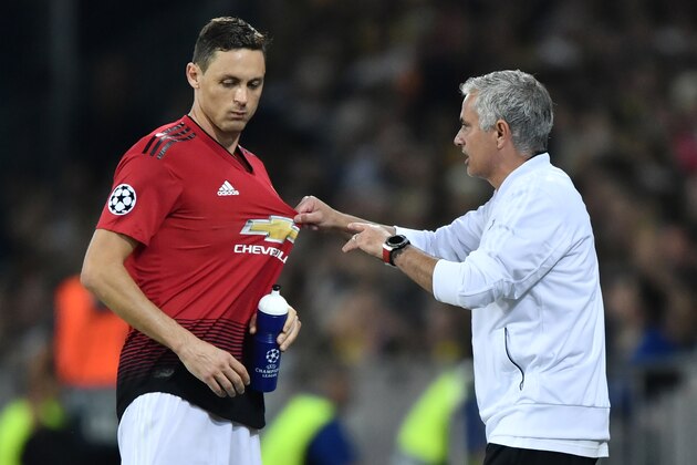 Manchester United's Portuguese manager Jose Mourinho (R) gestures as he speaks with Manchester United's Serbian midfielder Nemanja Matic during the UEFA Champions League group H football match between Young Boys and Manchester United at The Stade de Suisse in Bern on September 19, 2018. (Photo by Fabrice COFFRINI / AFP)        (Photo credit should read FABRICE COFFRINI/AFP/Getty Images)