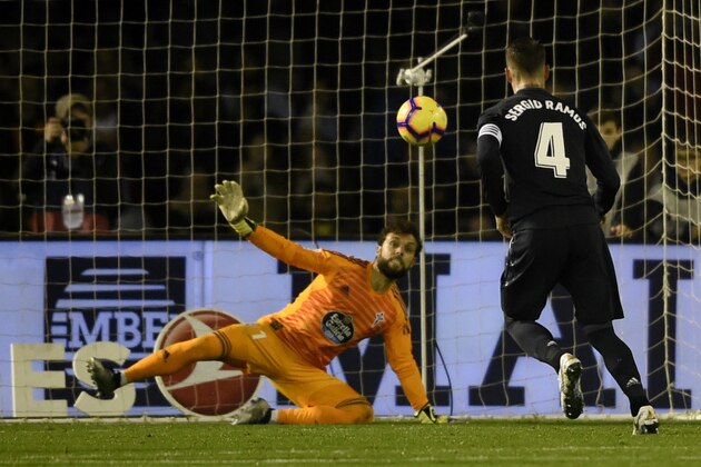 Real Madrid's Spanish defender Sergio Ramos shoots a penalty kick to score a goal to Celta Vigo's Spanish goalkeeper Sergio Alvarez during the Spanish league football match between RC Celta de Vigo and Real Madrid CF at the Balaidos stadium in Vigo on November 11, 2018. (Photo by MIGUEL RIOPA / AFP)        (Photo credit should read MIGUEL RIOPA/AFP/Getty Images)