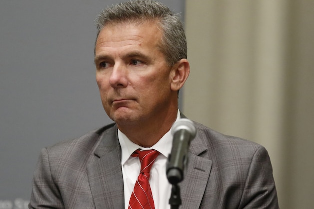 FILE - In this Aug. 22, 2018, file photo, Ohio State University coach Urban Meyer is listens during an NCAA college football press conference in Columbus, Ohio. Meyer will be back on the Ohio State sideline Saturday against Tulane after serving a three-game suspension. He was forced to sit out after the university determined he mismanaged the behavior of former assistant Zach Smith.  (AP Photo/Paul Vernon, File)