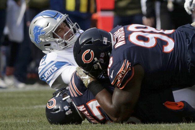 Detroit Lions quarterback Matthew Stafford (9) is sacked by Chicago Bears cornerback Bryce Callahan (37) and defensive tackle Bilal Nichols (98) during the first half of an NFL football game Sunday, Nov. 11, 2018, in Chicago. (AP Photo/David Banks)
