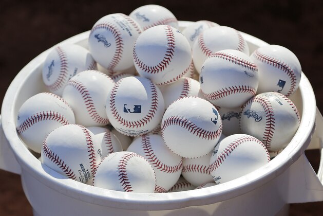 A bucket of baseballs sits in front of the dugout prior to a practice at Nationals Park, Wednesday, Oct. 4, 2017, in Washington. Game 1 of the National League Division Series against the Chicago Cubs is Friday. (AP Photo/Mark Tenally)