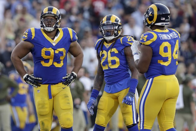 Los Angeles Rams nose tackle Ndamukong Suh (93), inside linebacker Mark Barron (26) and defensive end John Franklin-Myers (94) line up during the second half in an NFL football game against the Seattle Seahawks Sunday, Nov. 11, 2018, in Los Angeles. (AP Photo/Alex Gallardo)