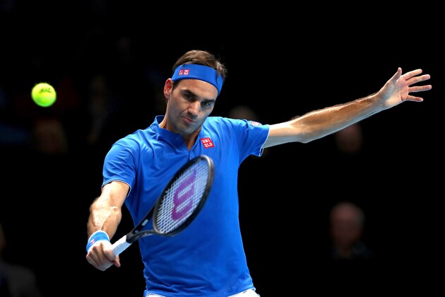 LONDON, ENGLAND - NOVEMBER 13:  Roger Federer of Switzerland plays a backhand during his singles round robin match against Dominic Thiem of Austria during Day Three of the Nitto ATP World Tour Finals at The O2 Arena on November 13, 2018 in London, England.  (Photo by Naomi Baker/Getty Images)