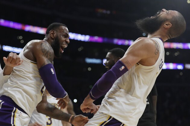 Los Angeles Lakers' Tyson Chandler, right, celebrates with teammate LeBron James after Chandler blocked a shot from Atlanta Hawks' Trae Young as time expired in the NBA basketball game Sunday, Nov. 11, 2018, in Los Angeles. Los Angeles won 107-106. (AP Photo/Marcio Jose Sanchez) Los Angeles Lakers' Tyson Chandler, right, celebrates with teammate LeBron James after Chandler blocked a shot from Atlanta Hawks' Trae Young as time expired in the NBA basketball game Sunday, Nov. 11, 2018, in Los Angeles. Los Angeles won 107-106. (AP Photo/Marcio Jose Sanchez)