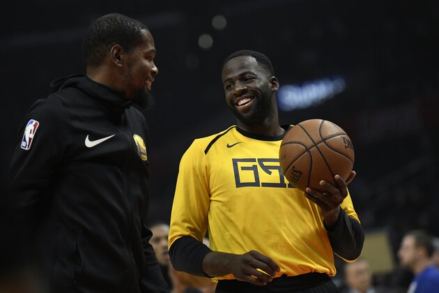 LOS ANGELES, CA - NOVEMBER 12:  Kevin Durant #35 of the Golden State Warriors talks to his teamate Draymond Green during warm up before the game against the Los Angeles Clippers on November 12, 2018 at STAPLES Center in Los Angeles, California. NOTE TO USER: User expressly acknowledges and agrees that, by downloading and or using this photograph, User is consenting to the terms and conditions of the Getty Images License Agreement. (Photo by Robert Laberge/Getty Images)