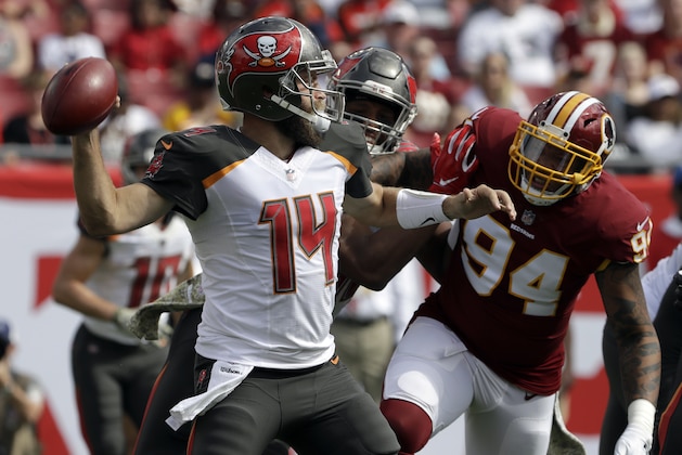 Tampa Bay Buccaneers quarterback Ryan Fitzpatrick (14) throws a pass as he is pressured by Washington Redskins outside linebacker Preston Smith (94) during the first half of an NFL football game Sunday, Nov. 11, 2018, in Tampa, Fla. (AP Photo/Chris O'Meara) Tampa Bay Buccaneers quarterback Ryan Fitzpatrick (14) throws a pass as he is pressured by Washington Redskins outside linebacker Preston Smith (94) during the first half of an NFL football game Sunday, Nov. 11, 2018, in Tampa, Fla. (AP Photo/Chris O'Meara)