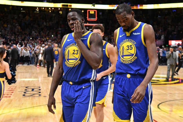 DENVER, CO - OCTOBER 21: Draymond Green #23 and Kevin Durant #35 of the Golden State Warriors walk off the court after losing to the Denver Nuggets at Pepsi Center on October 21, 2018 in Denver, Colorado. The Denver Nuggets defeated the Golden State Warriors 100-98. NOTE TO USER: User expressly acknowledges and agrees that, by downloading and or using this photograph, User is consenting to the terms and conditions of the Getty Images License Agreement. (Photo by Justin Tafoya/Getty Images)