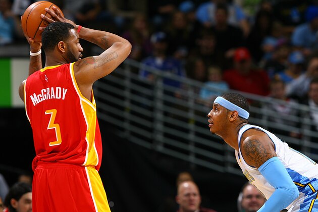 DENVER - DECEMBER 16: Tracy McGrady #3 of the Houston Rockets goes to the basket against Carmelo Anthony #15 of the Denver Nuggets on December 16, 2009 at the Pepsi Center in Denver, Colorado. NOTE TO USER: User expressly acknowledges and agrees that, by downloading and/or using this Photograph, user is consenting to the terms and conditions of the Getty Images License Agreement. Mandatory Copyright Notice: Copyright 2009 NBAE (Photo by Garrett W. Ellwood/NBAE via Getty Images)