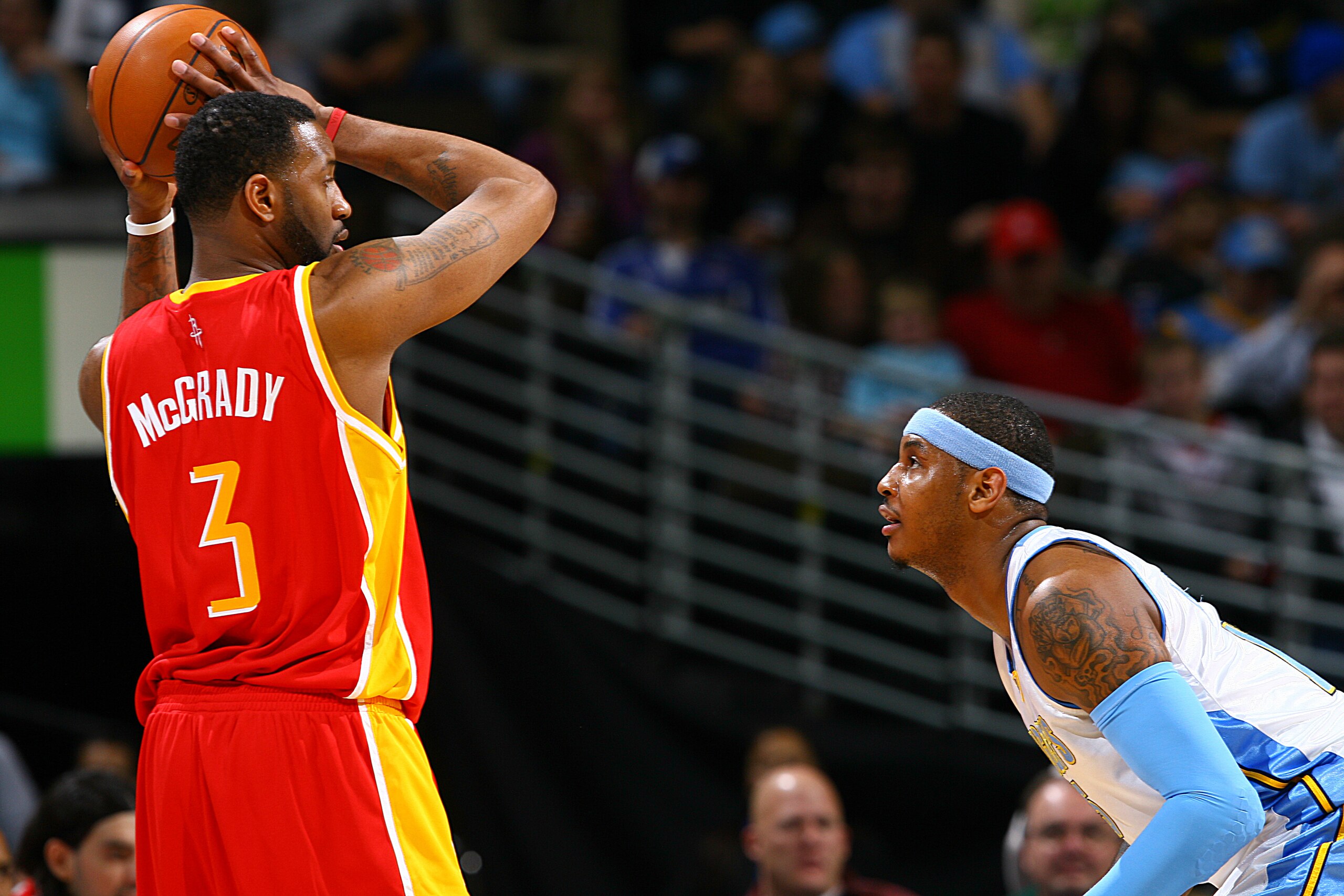 DENVER - DECEMBER 16: Tracy McGrady #3 of the Houston Rockets goes to the basket against Carmelo Anthony #15 of the Denver Nuggets on December 16, 2009 at the Pepsi Center in Denver, Colorado. NOTE TO USER: User expressly acknowledges and agrees that, by downloading and/or using this Photograph, user is consenting to the terms and conditions of the Getty Images License Agreement. Mandatory Copyright Notice: Copyright 2009 NBAE (Photo by Garrett W. Ellwood/NBAE via Getty Images)