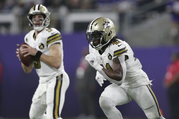 New Orleans Saints running back Alvin Kamara (41) runs past Drew Brees (9) against the Minnesota Vikings during an NFL football game, Sunday, Oct. 28, 2018, in Minneapolis. (AP Photo/Andy Clayton-King)