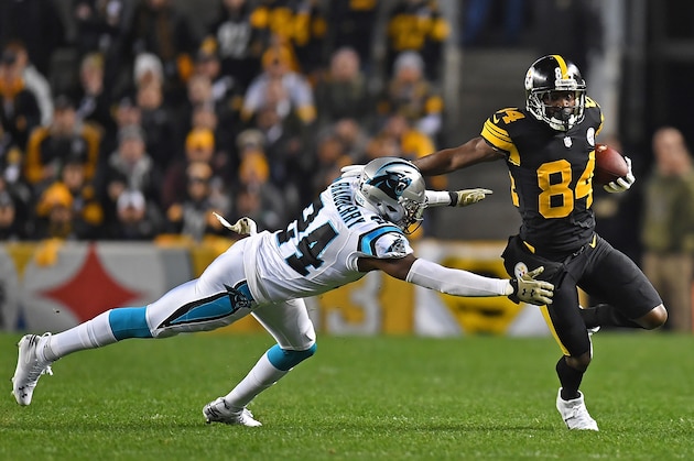 PITTSBURGH, PA - NOVEMBER 08: Antonio Brown #84 of the Pittsburgh Steelers runs up field as James Bradberry #24 of the Carolina Panthers attempts a tackle during the first half in the game at Heinz Field on November 8, 2018 in Pittsburgh, Pennsylvania. (Photo by Joe Sargent/Getty Images)