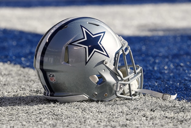 A Dallas Cowboys helmet is seen on the field before an NFL football game against the New York Giants at MetLife Stadium in East Rutherford, NJ, Sunday, Dec. 10, 2017. (Winslow Townson/AP Images for Panini)