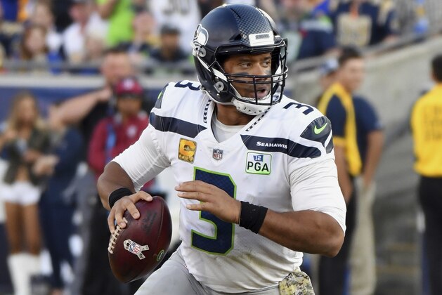 Seattle Seahawks quarterback Russell Wilson (3) scrambles with the ball during the second half of an NFL football game against the Los Angeles Rams, Sunday November 11, 2018 in Los Angeles. (John Cordes/AP Images for Panini)