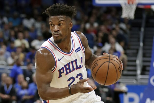 Philadelphia 76ers' Jimmy Butler moves the ball against the Orlando Magic during the first half of an NBA basketball game, Wednesday, Nov. 14, 2018, in Orlando, Fla. (AP Photo/John Raoux)