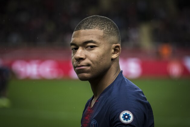 MONACO - NOVEMBER 11: Kylian Mbappé looks on before the Ligue 1 match between AS Monaco and Paris Saint-Germain at Stade Louis II on November 11, 2018 in Monaco, Monaco.  (Photo by Arnold Jerocki/Getty Images)