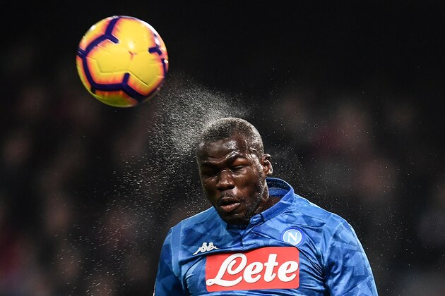 Napoli's Senegalese defender Kalidou Koulibaly heads the ball during the Italian Serie A football match Genoa vs Napoli at the Luigi-Ferraris stadium on November 10, 2018 in Genoa. (Photo by Marco BERTORELLO / AFP)        (Photo credit should read MARCO BERTORELLO/AFP/Getty Images)