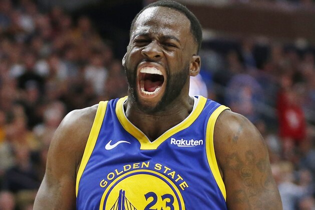 Golden State Warriors forward Draymond Green (23) shouts after being called with a foul in the second half during an NBA basketball game against the Utah Jazz Friday, Oct. 19, 2018, in Salt Lake City. (AP Photo/Rick Bowmer)
