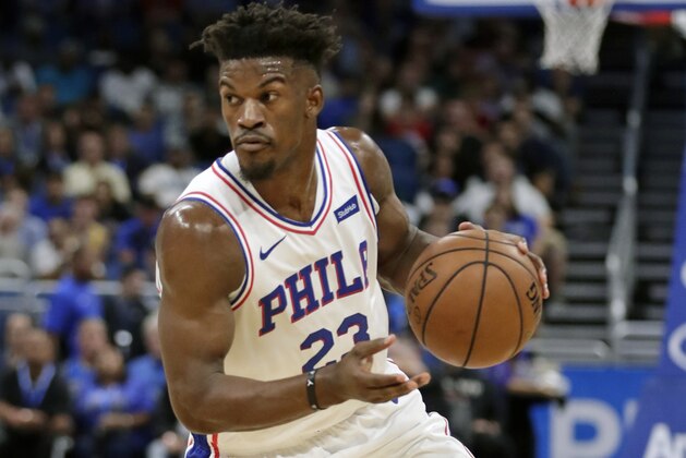 Philadelphia 76ers' Jimmy Butler moves the ball against the Orlando Magic during the first half of an NBA basketball game, Wednesday, Nov. 14, 2018, in Orlando, Fla. (AP Photo/John Raoux)
