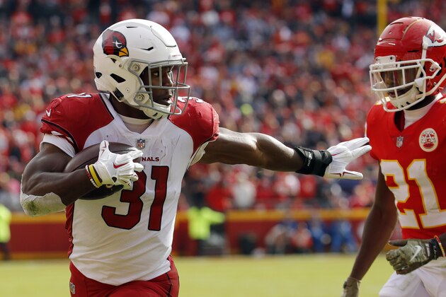 Arizona Cardinals running back David Johnson (31) runs for a touchdown away from Kansas City Chiefs defensive back Eric Murray (21) during the first half of an NFL football game in Kansas City, Mo., Sunday, Nov. 11, 2018. (AP Photo/Charlie Riedel)