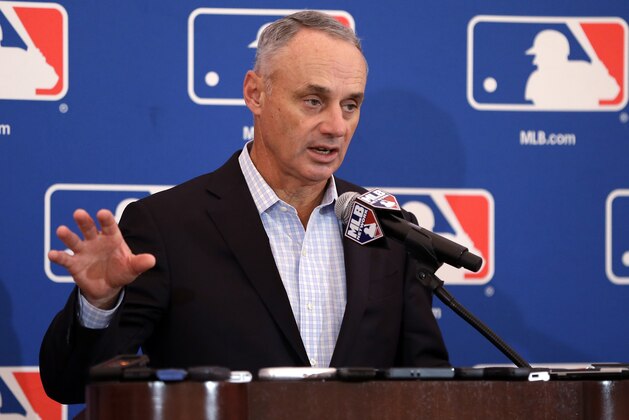 FILE - In this Nov. 16, 2017, file photo, baseball Commissioner Rob Manfred speaks during a news conference at the annual MLB owners meetings in Orlando, Fla. A person familiar with the agenda tells The Associated Press that owners plan to vote on a new term for Manfred, a new television contract with Fox and an agreement for in-game cut-ins with the subscription video streaming service DAZN when they meet next week in Atlanta. (AP Photo/John Raoux, File)