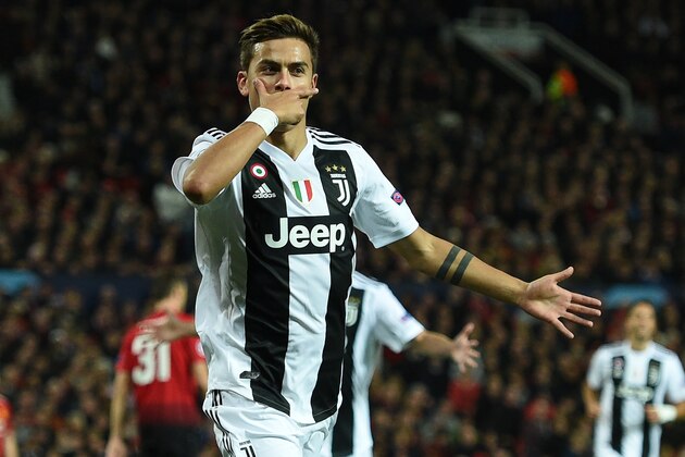 Juventus' Argentinian striker Paulo Dybala celebrates after scoring the opening goal of the Champions League group H football match between Manchester United and Juventus at Old Trafford in Manchester, north west England, on October 23, 2018. (Photo by Oli SCARFF / AFP)        (Photo credit should read OLI SCARFF/AFP/Getty Images)