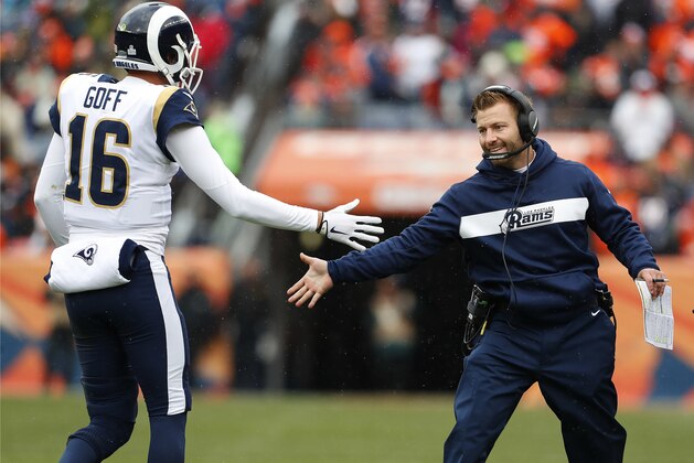 Los Angeles Rams head coach Sean McVay celebrates with quarterback Jared Goff (16) after a touchdown during the first half of an NFL football game against the Denver Broncos, Sunday, Oct. 14, 2018, in Denver. (AP Photo/Joe Mahoney)