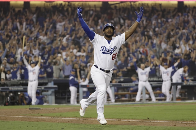 Los Angeles Dodgers' Yasiel Puig celebrates after hitting a three run home run during the sixth inning in Game 4 of the World Series baseball game against the Boston Red Sox on Saturday, Oct. 27, 2018, in Los Angeles. (AP Photo/David J. Phillip)