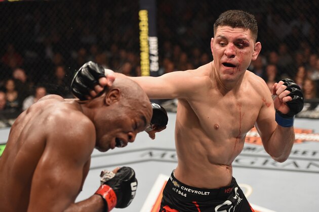 LAS VEGAS, NV - JANUARY 31:  (R-L) Nick Diaz punches Anderson Silva of Brazil in their middleweight bout during the UFC 183 event at the MGM Grand Garden Arena on January 31, 2015 in Las Vegas, Nevada.  (Photo by Josh Hedges/Zuffa LLC/Zuffa LLC via Getty Images)