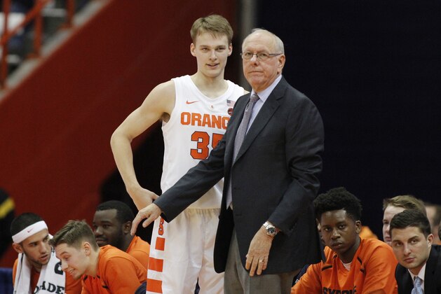 Syracuse head coach Jim Boeheim, right, talks with his son Buddy Boeheim, left, during the second half of an NCAA college basketball game against Saint Rose in Syracuse, N.Y., Thursday, Oct. 25, 2018. Syracuse won 80-49. (AP Photo/Nick Lisi)
