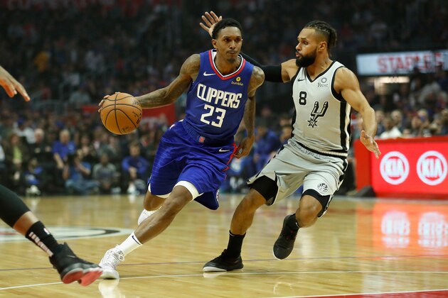 LOS ANGELES, CA - NOVEMBER 15:  Lou Williams #23 of the Los Angeles Clippers dribbles past Patty Mills #8 of the San Antonio Spurs during the first half of a game at Staples Center on November 15, 2018 in Los Angeles, California. NOTE TO USER: User expressly acknowledges and agrees that, by downloading and or using this photograph, User is consenting to the terms and conditions of the Getty Images License Agreement  (Photo by Sean M. Haffey/Getty Images)