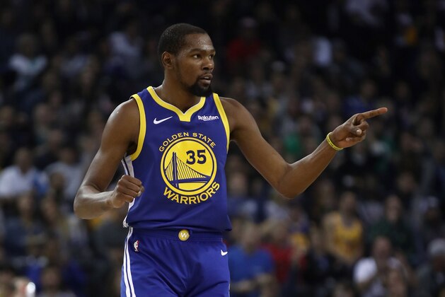 OAKLAND, CA - NOVEMBER 13:  Kevin Durant #35 of the Golden State Warriors reacts after the Warriors made a basket against the Atlanta Hawks at ORACLE Arena on November 13, 2018 in Oakland, California.  NOTE TO USER: User expressly acknowledges and agrees that, by downloading and or using this photograph, User is consenting to the terms and conditions of the Getty Images License Agreement.  (Photo by Ezra Shaw/Getty Images)