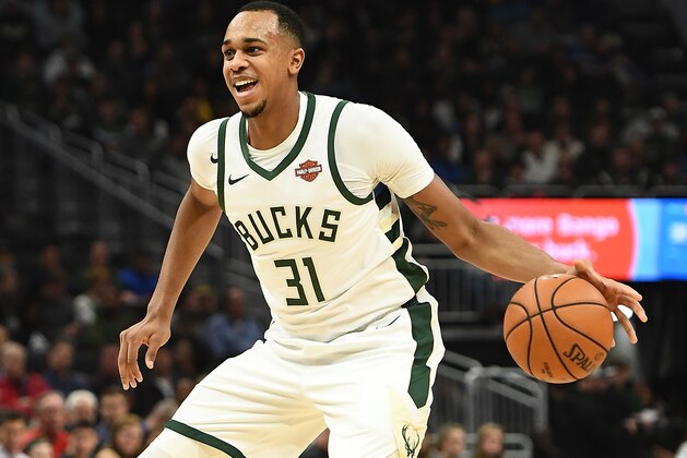 MILWAUKEE, WI - OCTOBER 29:  John Henson #31 of the Milwaukee Bucks handles the ball during a game against the Toronto Raptors at Fiserv Forum on October 29, 2018 in Milwaukee, Wisconsin. NOTE TO USER: User expressly acknowledges and agrees that, by downloading and or using this photograph, User is consenting to the terms and conditions of the Getty Images License Agreement.  The Bucks defeated the Raptors 124-109.  (Photo by Stacy Revere/Getty Images)