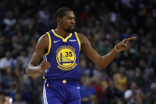 OAKLAND, CA - NOVEMBER 13:  Kevin Durant #35 of the Golden State Warriors reacts after the Warriors made a basket against the Atlanta Hawks at ORACLE Arena on November 13, 2018 in Oakland, California.  NOTE TO USER: User expressly acknowledges and agrees that, by downloading and or using this photograph, User is consenting to the terms and conditions of the Getty Images License Agreement.  (Photo by Ezra Shaw/Getty Images)
