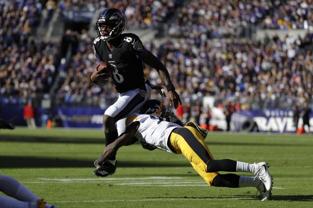 BALTIMORE, MD - NOVEMBER 04: Quarterback Lamar Jackson #8 of the Baltimore Ravens is tackled as he carries the ball by cornerback Mike Hilton #28 of the Pittsburgh Steelers in the second quarter at M&T Bank Stadium on November 4, 2018 in Baltimore, Maryland. (Photo by Scott Taetsch/Getty Images)