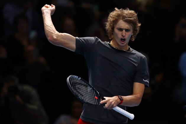 LONDON, ENGLAND - NOVEMBER 16:  Alexander Zverev of Germany celebrates after winning match point in his third singles round robin match against John Isner of The United States during Day Six of the Nitto ATP Finals at The O2 Arena on November 16, 2018 in London, England.  (Photo by Clive Brunskill/Getty Images)