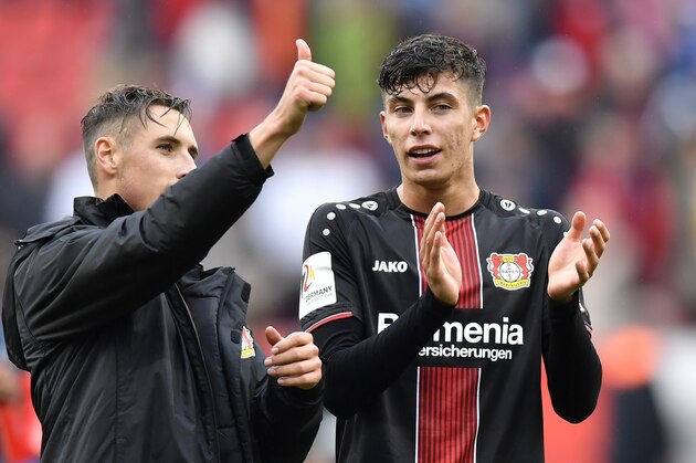 Leverkusen's Dominik Kohr, left, and Leverkusen's Kai Havertz, right, celebrate after winning the German Bundesliga soccer match between Bayer 04 Leverkusen and FSV Mainz 05 in Leverkusen, Germany, Sunday, Sept. 23, 2018. (AP Photo/Martin Meissner)