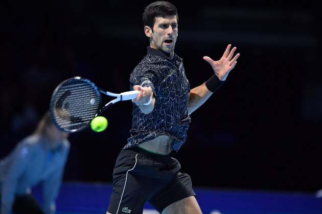 Serbia's Novak Djokovic returns against South Africa's Kevin Anderson during their men's singles semi-final match on day seven of the ATP World Tour Finals tennis tournament at the O2 Arena in London on November 17, 2018. (Photo by Ben STANSALL / AFP)        (Photo credit should read BEN STANSALL/AFP/Getty Images)