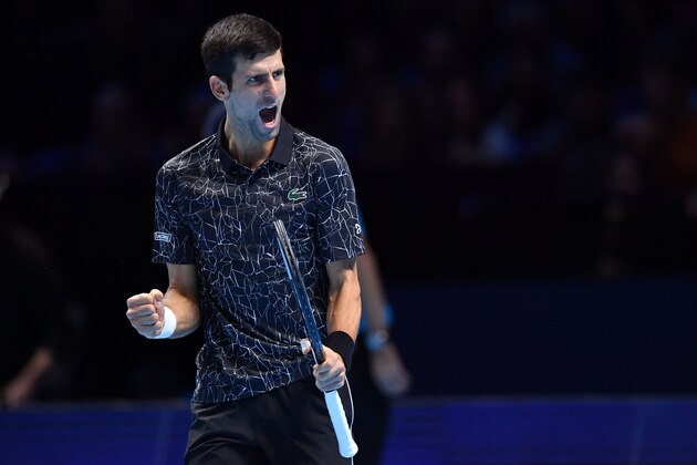 Serbia's Novak Djokovic reacts after winning a game during their men's singles semi-final match against South Africa's Kevin Anderson on day seven of the ATP World Tour Finals tennis tournament at the O2 Arena in London on November 17, 2018. (Photo by Ben STANSALL / AFP)        (Photo credit should read BEN STANSALL/AFP/Getty Images)