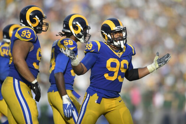LOS ANGELES, CA - OCTOBER 28: Aaron Donald #99 of the Los Angeles Rams celebrates after he sacked Aaron Rodgers #12 of the Green Bay Packers at Los Angeles Memorial Coliseum on October 28, 2018 in Los Angeles, California. (Photo by John McCoy/Getty Images)
