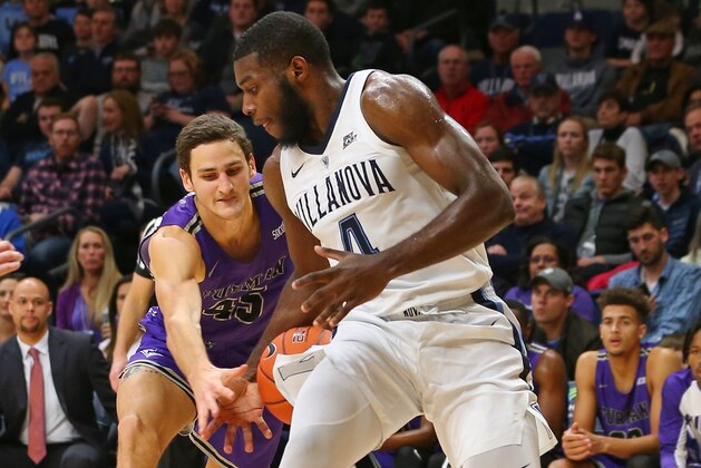 VILLANOVA, PA - NOVEMBER 17: Clay Mounce #45 of the Furman Paladins attempts to strip the ball away from Eric Paschall #4 of the Villanova Wildcats during the first half of a game at Finneran Pavilion on November 17, 2018 in Villanova, Pennsylvania. (Photo by Rich Schultz/Getty Images)