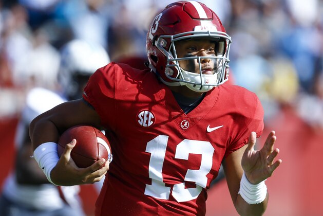 Alabama quarterback Tua Tagovailoa (13) carries the ball during the first half of an NCAA college football game against Citadel, Saturday, Nov. 17, 2018, in Tuscaloosa, Ala. (AP Photo/Butch Dill)