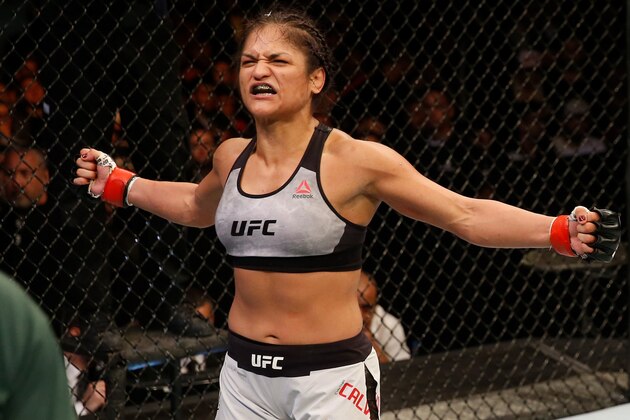 BUENOS AIRES, ARGENTINA - NOVEMBER 17:  (R-L) Cynthia Calvillo celebrates after defeating Poliana Botelho of Brazil in their women's strawweight bout during the UFC Fight Night event inside Arena Parque Roca on November 17, 2018 in Buenos Aires, Argentina. (Photo by Alexandre Schneider/Zuffa LLC/Zuffa LLC via Getty Images)