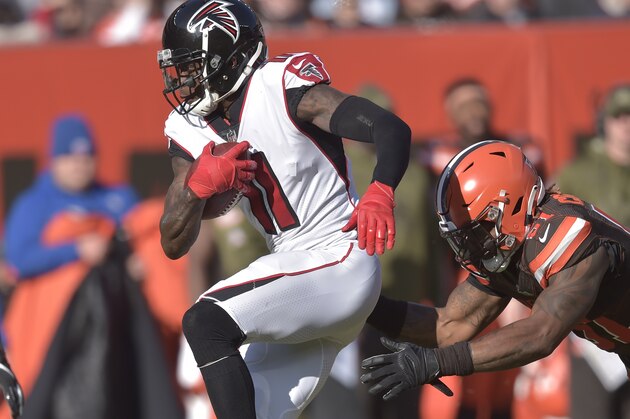 Atlanta Falcons wide receiver Julio Jones (11) runs after a catch during a 28-16 loss against the Cleveland Browns in an NFL football game, Sunday, Nov. 11, 2018, in Cleveland. Jones became the fastest player in NFL history to 10,000 receiving yards with the 30-yard, second-quarter reception. (AP Photo/David Richard)