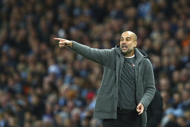 Manchester City's coach Pep Guardiola gives instructions during the English Premier League soccer match between Manchester City and Manchester United at the Etihad stadium in Manchester, England, Sunday, Nov. 11, 2018. (AP Photo/Dave Thompson)