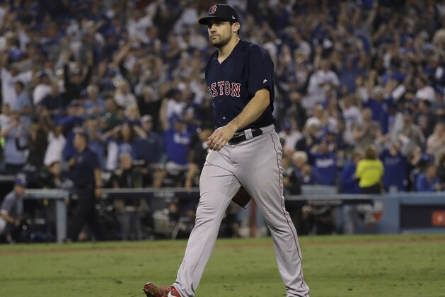 Boston Red Sox pitcher Nathan Eovaldi walks off the field after giving up a walk off home run to Los Angeles Dodgers' Max Muncy during the 18th inning in Game 3 of the World Series baseball game to defeat the Boston Red Sox 3-2 on Saturday, Oct. 27, 2018, in Los Angeles. (AP Photo/David J. Phillip)