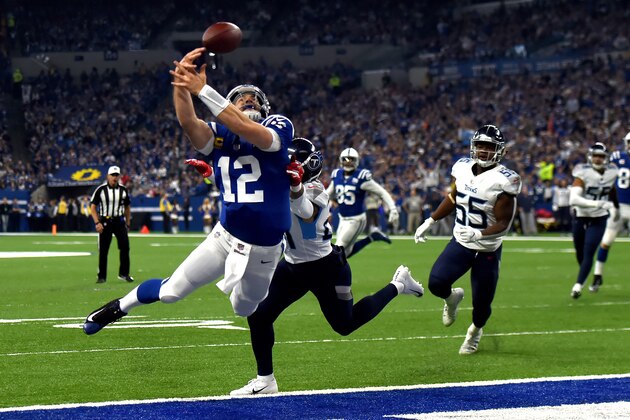 INDIANAPOLIS, INDIANA - NOVEMBER 18: Andrew Luck #12 of the Indianapolis Colts dives for a catch in the game against the Tennessee Titans in the second quarter at Lucas Oil Stadium on November 18, 2018 in Indianapolis, Indiana. (Photo by Bobby Ellis/Getty Images)