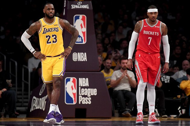 LOS ANGELES, CA - OCTOBER 20:  LeBron James #23 of the Los Angeles Lakers and Carmelo Anthony #7 of the Houston Rockets wait for and inbound at Staples Center on October 20, 2018 in Los Angeles, California.  (Photo by Harry How/Getty Images)
